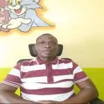 Dr. John Ngugi Maina